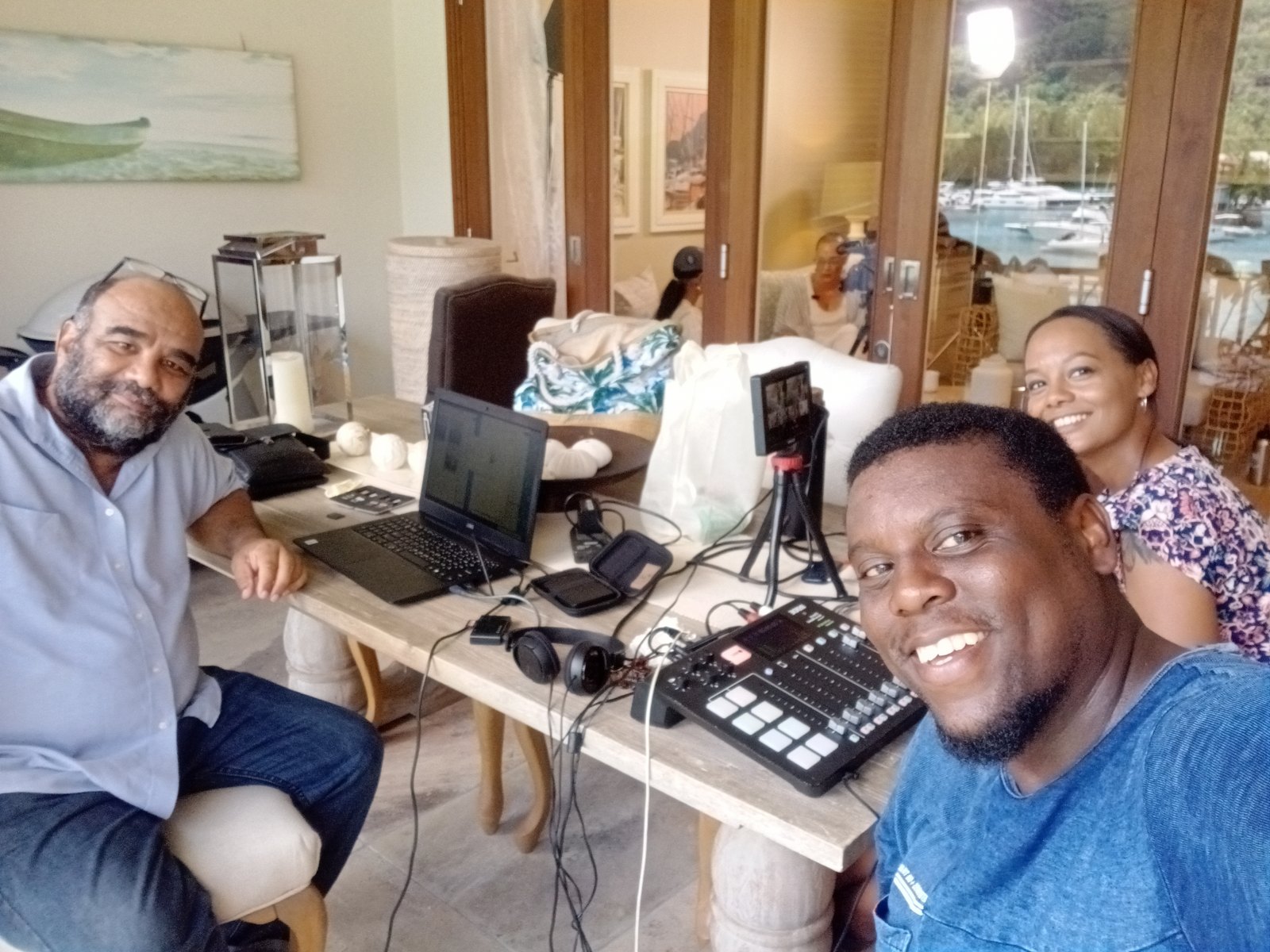 Allen with colleagues at an audio recording setup