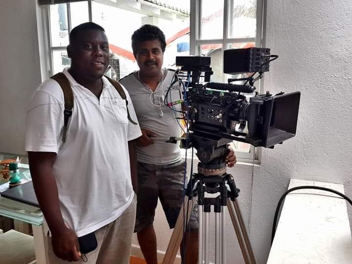 Allen and a fellow filmmaker beside a cinema camera
