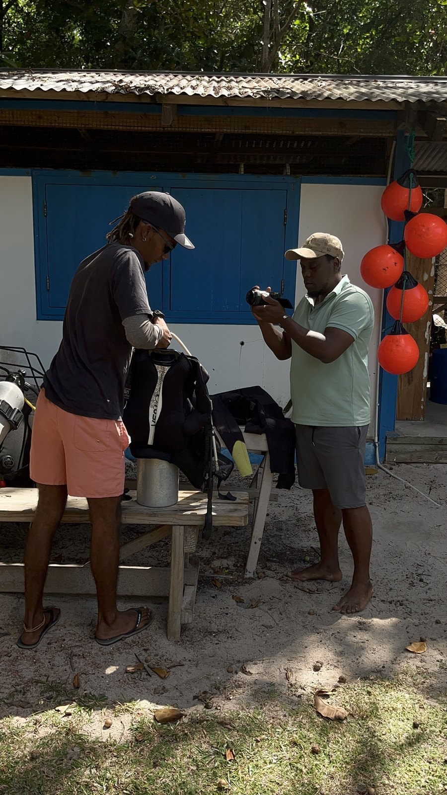 Allen filming on location with a handheld camera