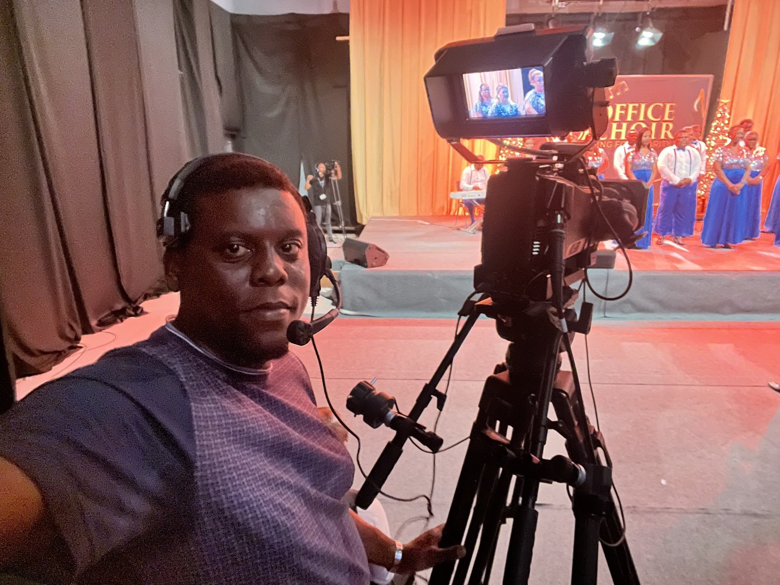 Allen working with a cinema camera on set